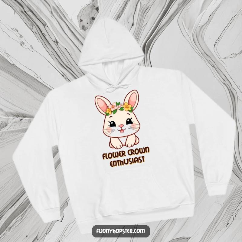Funny hoodie showcasing a smiling rabbit character sporting a tiny flower crown, radiating warmth and whimsical delight.