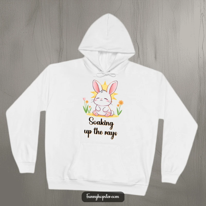Funny rabbit character basking in the sun, eyes closed in contentment, printed on a warm and snuggly hoodie for ultimate comfort.